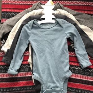 Set of 4 newborn onesies